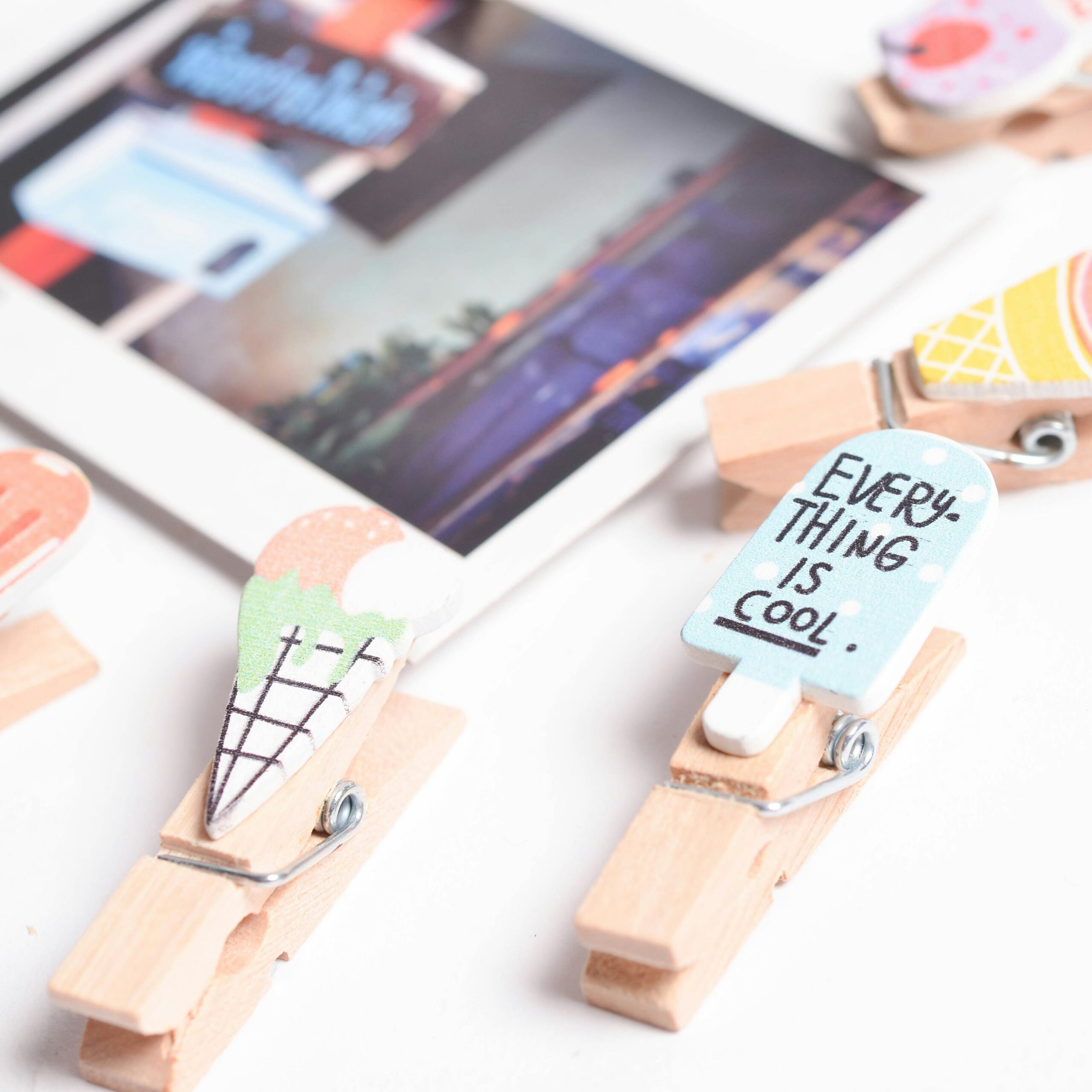 brown wooden clothes pin on white wooden table